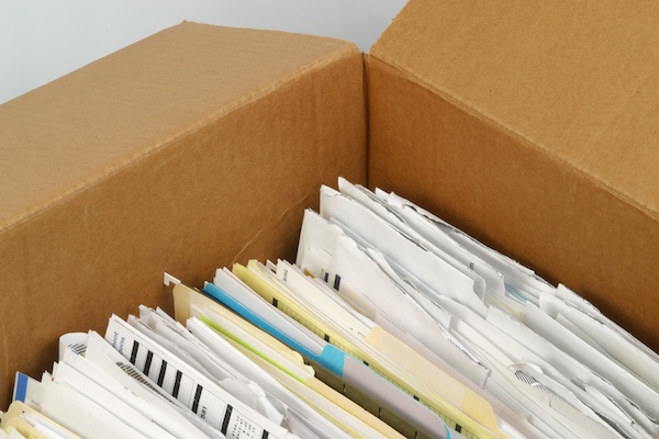 Documents stored in cardboard boxes